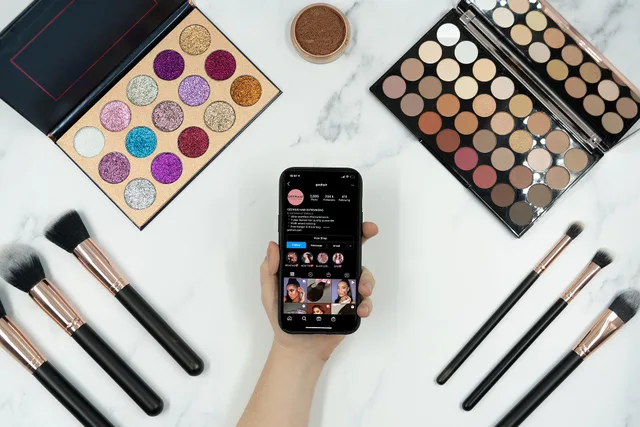 This photo shows someone using Instagram to watch and follow along with a make up tutorial. A selection of make up brushes and eyeshadow palettes can be seen around their phone. We've now made the decision to release this photo under Creative Commons so you can use it too! Just remember to credit us. How to plan Cardiff beauty creator campaigns in Welsh and English